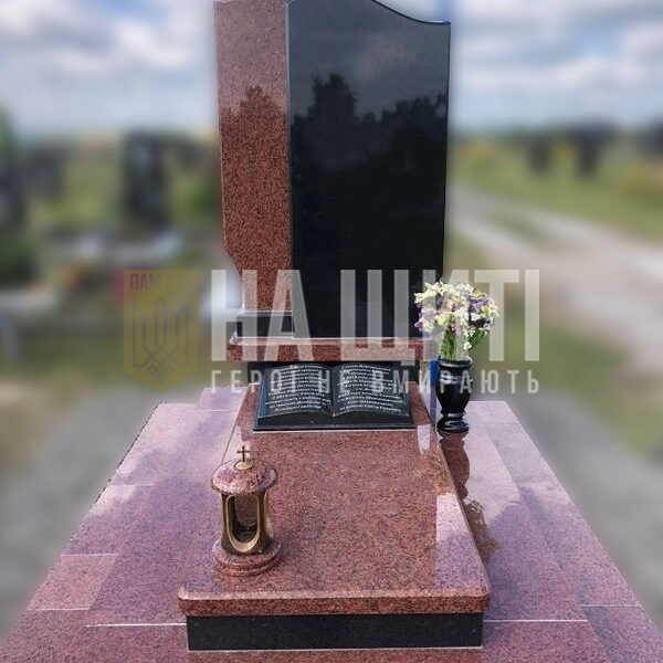 Червоний гранітний пам'ятник для військового з асиметричним надгробком і гранітною книгою