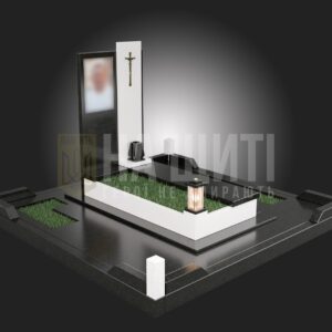Пам'ятник Герою з чорно-білим кам'яним оформленням